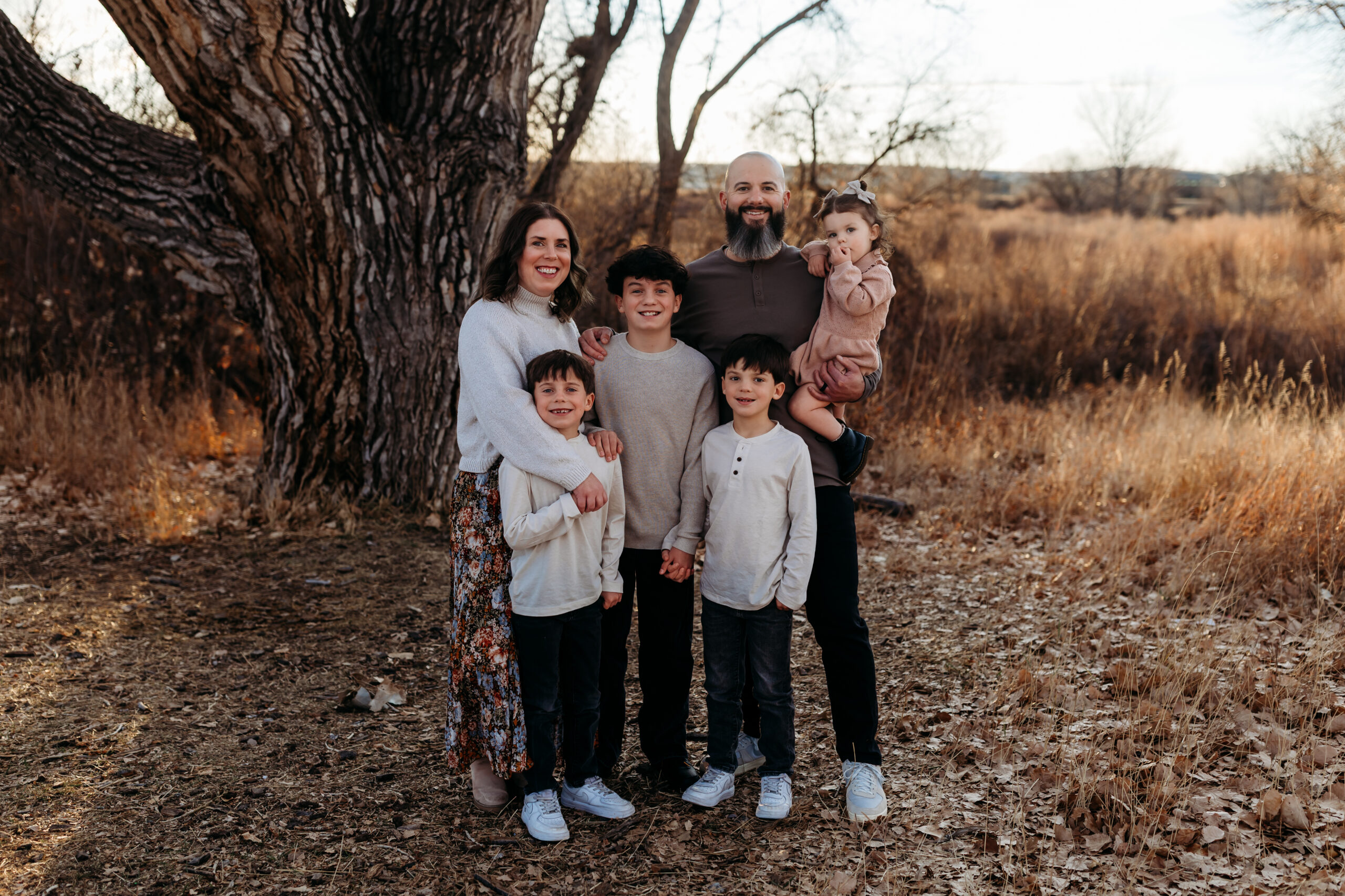 Family of 5 in meadow by Brighton Family Photographer
