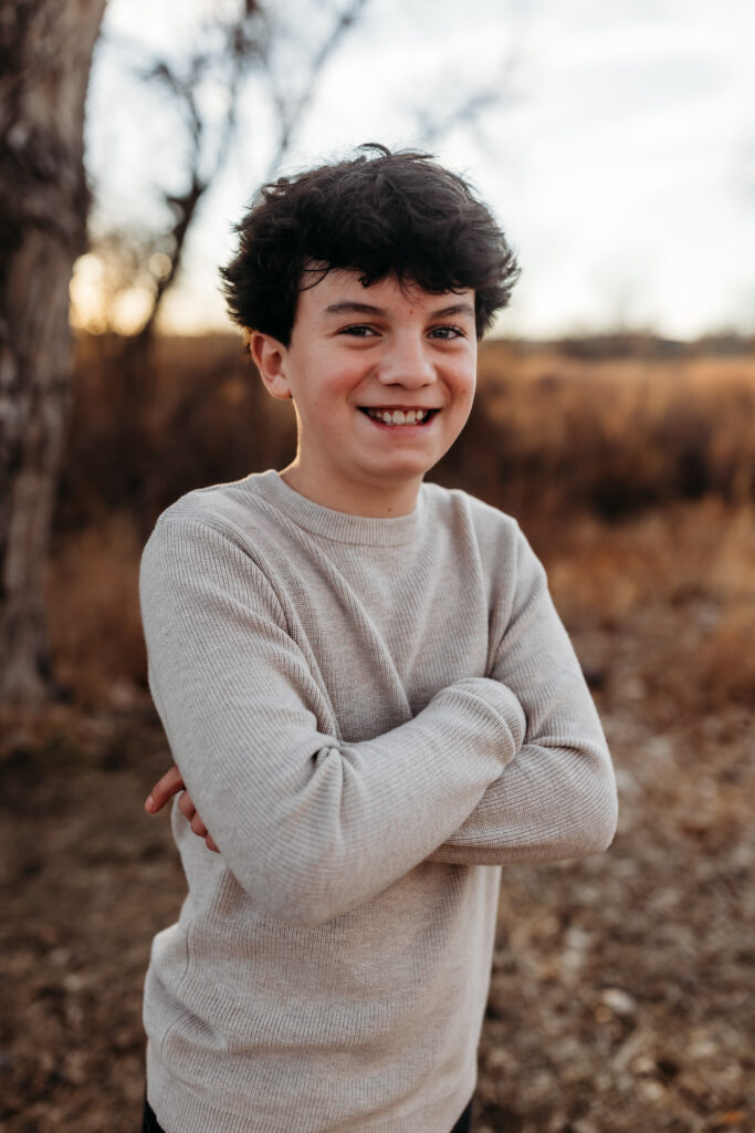 photo of oldest son family of 5 by brighton family photographer